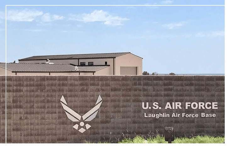 A large brick wall with the words u. S. Air force laughlin air force base written on it